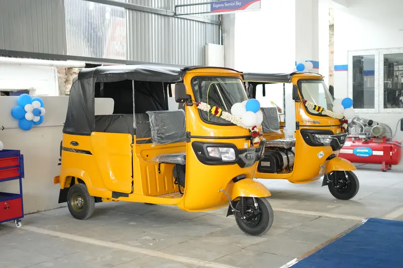 Two TVS King autos in the express service bay at Vijay TVS, Coimbatore