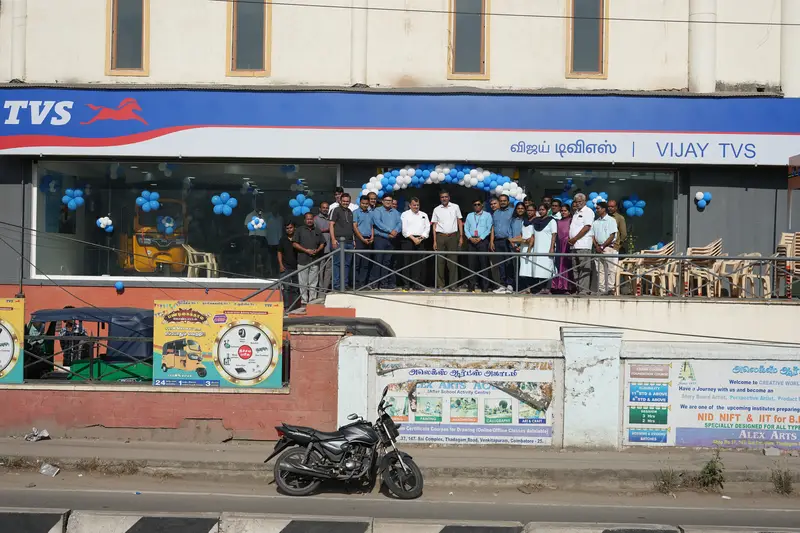 Vijay TVS showroom on Thadagam Road, Venkitapuram, Coimbatore, with the team outside